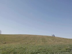 WS Young couple running together up and over hill / Taylors Falls, Minnesota, United States Stock Footage