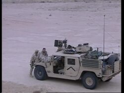 GWT: Kuwaiti soldiers at border plus shots of Umm Qasr in distance News Clip