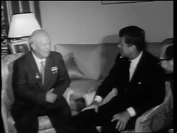 B/W 1960s John Kennedy + Nikita Khrushchev sitting in chairs talking / Germany / newsreel Stock Footage