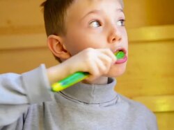 Small boy brushing teeth Stock Footage