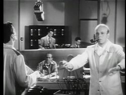 B/W 1945 Frank Sinatra in studio talking with conductor + technicians / short film Stock Footage