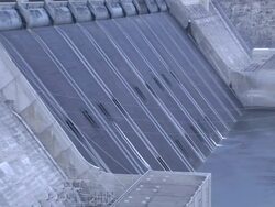 Multiple tilt-up zoom-out - Water flows from the spillway of the Grand Coulee Dam / Grand Coulee Dam, Washington Stock Footage