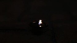 the light from the candle lit at night around wat maheyong Stock Footage