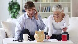 senior couple calculating domestic bills Stock Footage