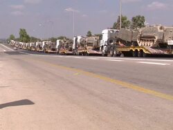 IDF military convoy at roadside in Sderot News Clip