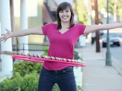 MS TD TU Young woman hula hooping on city street / Richmond, Virginia, United States Stock Footage