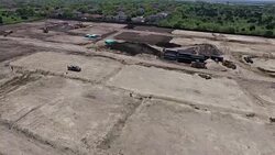 High Day Time Sunny Angle Construction Yard Stripped Acres of Land Over Aerial Drone View With Dramatic background Austin Texas Round Rock TX New Home Community Stock Footage