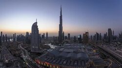 United Arab Emirates, Dubai, the Burj Khalifa, elevated view looking over the Dubai Mall - time lapse Stock Footage
