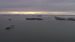 Small, rocky islands dot a shoreline in Nova Scotia. Stock Footage