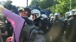 Riot police and protesters during G20 in Hamburg News Clip