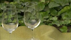 A plate displays typical antipasto foods near empty wine glasses in Florence, Italy. Stock Footage
