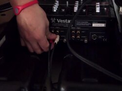 A DJ plugs in equipment Stock Footage