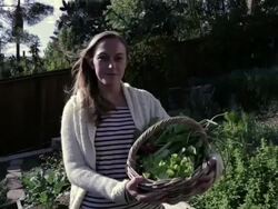 MS ZI Woman holding basket and standing in garden / Los Angeles, California, United States Stock Footage