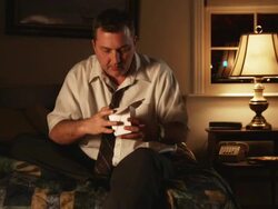 man eating Chinese food from a box rather than using chopsticks Stock Footage