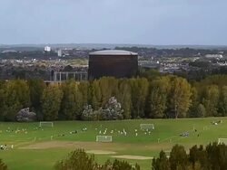 WS T/L View of Footballers play on Hackney Marshes against expansive backdrop of city / London, United Kingdom  Stock Footage