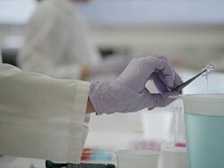 Close up, laboratory technician conducts modern scientific testing with colorful solutions Stock Footage
