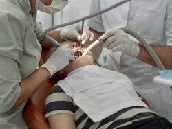 HD: Dentist Drilling A Boy's Tooth Stock Footage