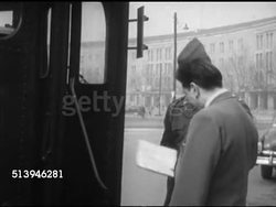 1953: UNITED STATES BERLIN TOUR BUSES: GERMANY: VS People, tourists, boarding 'Berlin Command Bus Line' tour bus on street in American Sector in West Berlin. VS Buses driving off. Instructional Video