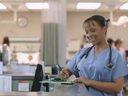 Female Doctor filling out forms Stock Footage