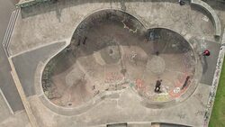 Skateboarder Riding a Bowl at Skatepark Stock Footage