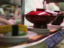 MS Colorful plates with sushi rotating in sushi bar / Shibuya, Tokyo, Japan Stock Footage