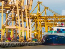 Loading cargo from truck to containership at the Shipping port Stock Footage