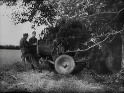 A German soldier plays on a church organ. At the edge of a wood German and American soldiers fire missiles at one another Stock Footage