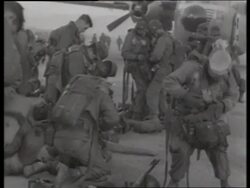 B/W 1950's soldiers strapping on parachutes / Korea / NO SOUND Stock Footage