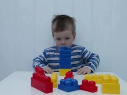 Young boy with building bricks Stock Footage