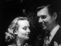 B/W 1939 close up newlyweds Clark Gable + Carole Lombard looking into each others eyes outdoors / newsreel Stock Footage