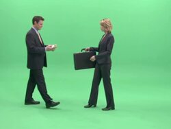 WS, Businesspeople passing bundle of money and briefcase to each other in studio Stock Footage