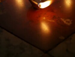 CU POV  Burning clay oil lamps on  floor / Singapore Stock Footage
