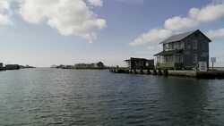 Homes occupy land on a man-made island. Stock Footage