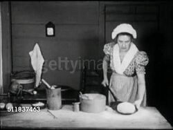 MOT: EARLY AMERICANA: HOMEMAKING REENACTMENT: Woman in period clothing long dress placing pan of dough onto long handled shovel, sliding into hearth brick oven, bread Instructional Video