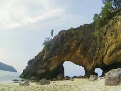 Time lapse of Natural stone arch with beautiful beach Stock Footage