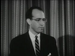 B/W 1961 Jonas Salk (polio vaccine discoverer) smiling + talking Stock Footage