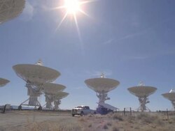  WS PAN View of truck pulling solar panel through Very Large Array / San Augustine, New Mexico, USA Stock Footage