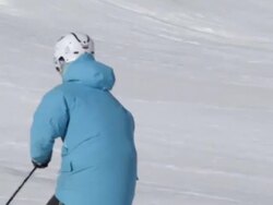 A skier doing a jumping trick on skis in the winter at a ski resort. Stock Footage