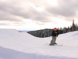 A man skiing down a snow-covered mountain in the winter. - Slow Motion Stock Footage