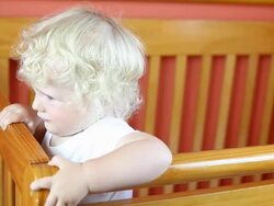 Baby boy crying in crib Stock Footage