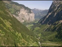 WS AERIAL TS View of Lauterbrunnen valley with hamlet lengwald and murrenflue rock face / Lautebrunnen Valley, Bern, Switzerland Stock Footage