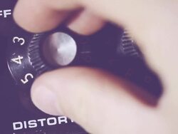 Guitarist Push Up the distortion on Amplifier Stock Footage