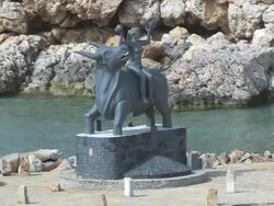 MS AERIAL DS Shot of Zeus statue with Europa / Agios Nikolaos, Crete, Greece Stock Footage