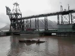 The old harbor of the abandoned Russian settlement and coal mining community Pyramiden on the archipelago of Svalbard, Norway Stock Footage