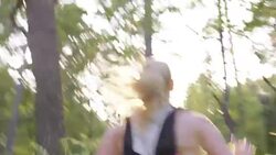 TS Female marathon competitor running in forest Stock Footage