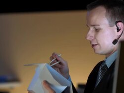 HD DOLLY: Executive Eating While Talking Over The Headset Stock Footage