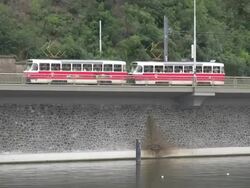 European Commuters: Trams Across River Stock Footage
