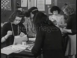 1944: SPRINGFIELD PLAN: EXT PUBLIC School. INT classroom, printing press working, girls binding books. CU book pages w/ drawings: America, China, Czechoslovakia. EXT PAROCHIAL School. INT St. Michael's Cathedral classroom w/ nun & students. Instructional Video