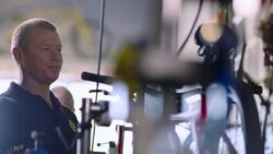 Boss chats with employee in bicycle repair shop Stock Footage