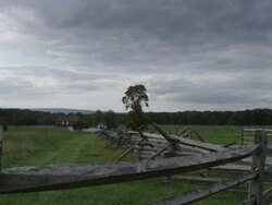 WS View of wooden fence and field, with dark clouds in sky / Gettysburg, Pennsylvania, United States Stock Footage
